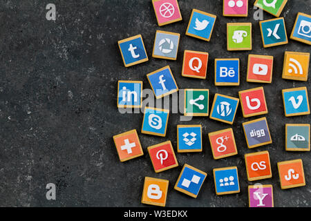 QUEENSTOWN, SOUTH AFRICA - 7 JULY 2019 -Social media background with social media logos on wooden game block on grey mottled background - Social netwo Stock Photo