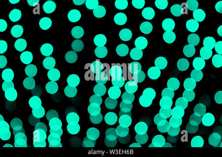 Unfocused abstract colourful bokeh black background. defocused and blurred many round blue light. Stock Photo