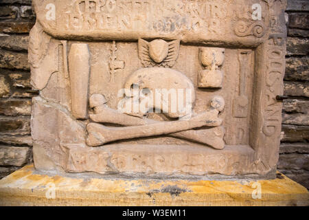 Skull and cross bones on ancient grave stones in St Magnus Cathedral in Kirkwall, Orkney, UK. Stock Photo