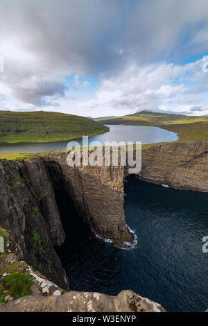 Incredible view of Sorvagsvatn lake on cliffs of Vagar island in sunset ...