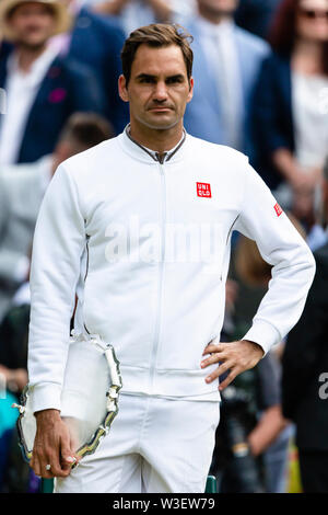 London, UK. 14th July, 2019. Tennis: Grand Slam/ATP Tour, Wimbledon, Individual, Men, Final, Djokovic (Serbia) - Federer (Switzerland). Roger Federer is standing on the lawn during the award ceremony. Credit: Frank Molter/dpa/Alamy Live News Stock Photo