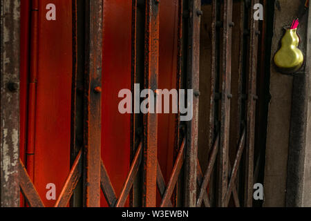 Ancient iron orange doors are very rusty for background, Steel folding gates, thailand, Vector illustration. Stock Photo
