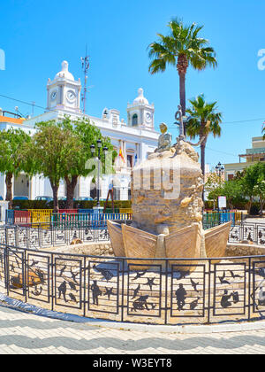 Monument statue to the Fisherman with the Barbate Town Hall in the background. Plaza De La Inmaculada Square. Barbate, Andalusia, Spain. Stock Photo