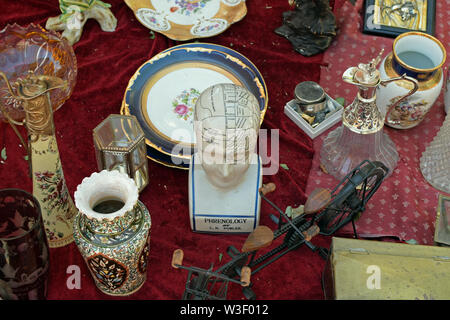 ATHENS, GREECE - AUGUST 14, 2016: Antique objects and porcelain phrenological bust with areas of the head assigned to specific character traits and br Stock Photo