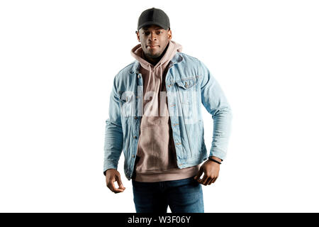 awesome cool strong guy dressed casually looking at the camera. isolated white background. studio shot, lifestyle, interest. street look Stock Photo