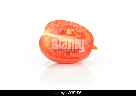One half of fresh red tomato cherry isolated on white background Stock Photo