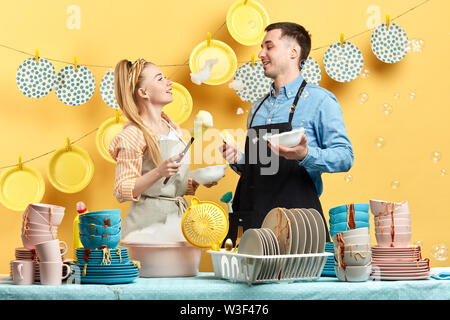 young family playing with foam and bubbles at home. entertainment concept Stock Photo