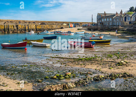 Small fishing boats in Mousehole harbour Cornwall England GB UK EU Europe Stock Photo