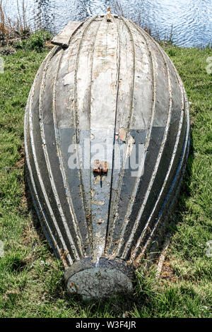 An old wooden boat lies on the sand Stock Photo - Alamy
