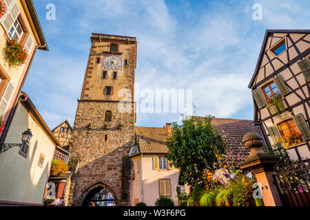 town gate of the wine village Ribeauvillé, Alsace Wine Route, France, town tower in the scenic evening light of the late summer Stock Photo