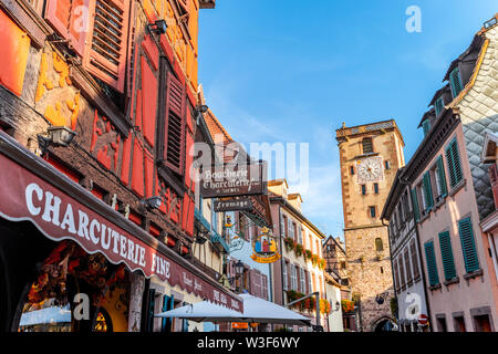 inside of the village Ribeauvillé, Alsace Wine Route, France, street towards the gate tower Stock Photo