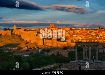 Medieval monumental walls and the four posts monument at sunset, UNESCO World Heritage Site. Avila city. Castilla León, Spain Europe Stock Photo