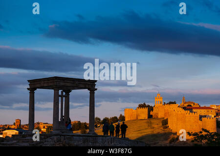 Medieval monumental walls and the four posts monument at sunset, UNESCO World Heritage Site. Avila city. Castilla León, Spain Europe Stock Photo
