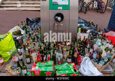 Lots of empty glass bottles in a glass container for recycling. Bordeaux, Gironde. Aquitaine region. France Europe Stock Photo