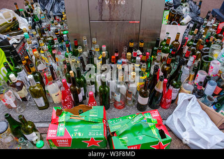 Lots of empty glass bottles in a glass container for recycling. Bordeaux, Gironde. Aquitaine region. France Europe Stock Photo