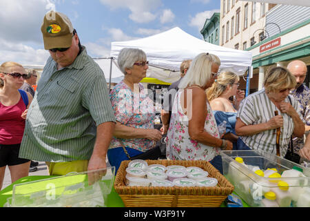 Customers enjoy samples at the annual Little Falls Cheese Festival in Herkimer County, New York, USA Stock Photo