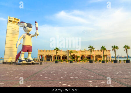 Doha, Qatar - February 23, 2019: Giant statue of Orry The Oryx, mascot of the Asian Games 2006 along the Corniche close to Al Mourjan luxury Stock Photo