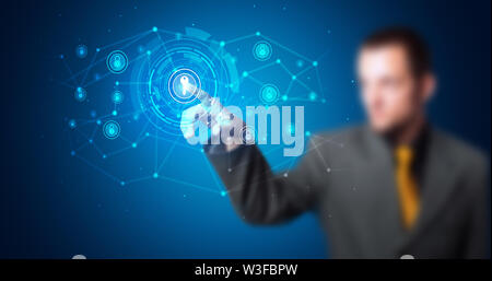 Man touching hologram screen displaying keys and locks Stock Photo