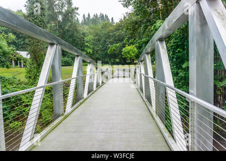 A walking bridge gives access to Maplewood Park in Renton, Washington. Stock Photo