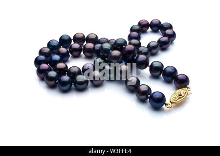 A necklace of black pearls with a gold clasp on a white background.