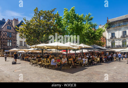 Tourists occupying cafes and restaurants in middle of Place Plumereau, Tours, Indre-et-Loire, France. Stock Photo