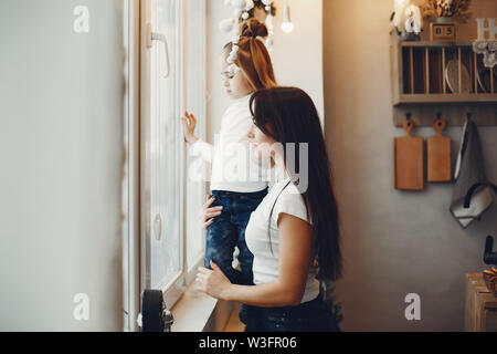 Mother with cute daughter at home Stock Photo