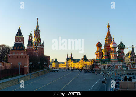 Moscow, Russia, May 30, 2019: St. Basil's Cathedral and Kremlin Walls and Tower in Red square in sunny blue sky. Red square is Attractions popular's t Stock Photo