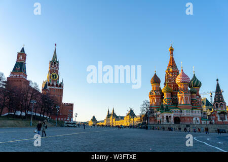 Moscow, Russia, May 30, 2019: St. Basil's Cathedral and Kremlin Walls and Tower in Red square in sunny blue sky. Red square is Attractions popular's t Stock Photo