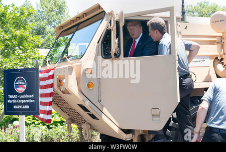 July 15, 2019 - Washington, DC, United States: United States President Donald J. Trump examines a THAAD (Terminal High Altitude Area Defense) missile launcher on display at the 3rd Annual Made in America Product Showcase at the White House. Credit: Chris Kleponis/Pool via CNP /MediaPunch Stock Photo