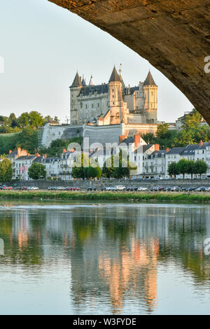 Views of the city of Saumur from the riverbank at dusk, with the castle in the background. Loire Valley, France. Stock Photo