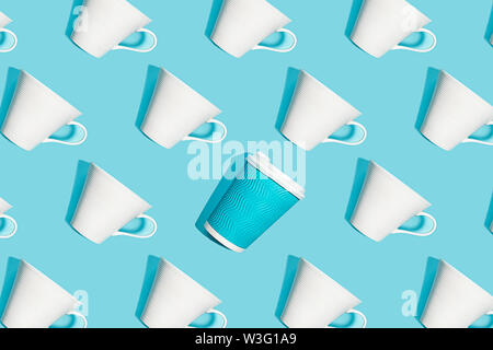Coffee pattern of white ceramic cups for coffee on bright blue background. Stock Photo