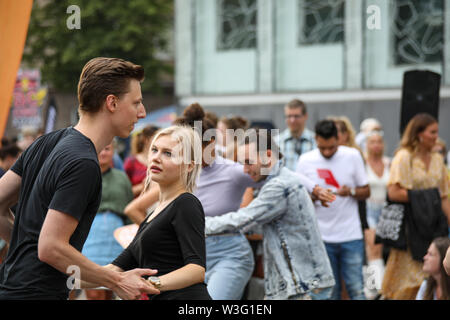 People dancing in the streets of Hakaniemi at Kallio Block Party in Helsinki, Finland Stock Photo