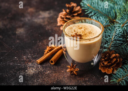 Christmas eggnog in a glass in a Christmas background. Stock Photo