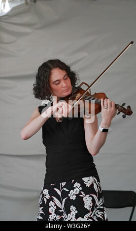 Littleton, Colorado - July 13, 2019: Violinist of Indigent Row Irish Band performing on the stage of Colorado Irish Festival. Stock Photo