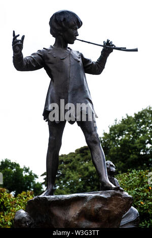 Bronze statue of Peter Pan by sculptor Peter Frampton outside the Palm House at Sefton Park, Liverpool (UK). Only 7 sculptures were cast from the orig Stock Photo