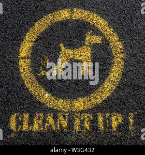 "Clean it up" road sign in Liverpool, UK warning dog walkers to pick up their dog litter Stock Photo