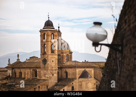 Urbino Cathedral (in italian: Duomo di Urbino, Cattedrale Metropolitana di Santa Maria Assunta) background. Morning far away view Stock Photo