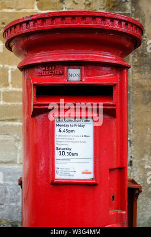 Traditional Royal Mail red postbox in Lacock, Wiltshire, UK Stock Photo