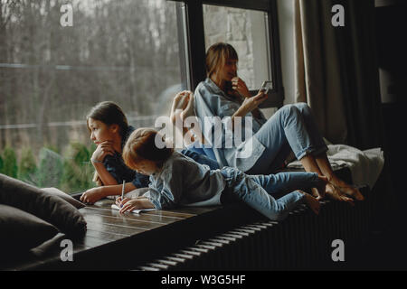 Mother with daughters at home Stock Photo