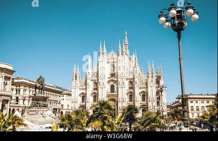 Milan, Italy - 1st of May, 2019: View of Duomo di Milano Cathedral with people around it. Authentic toned image. Stock Photo