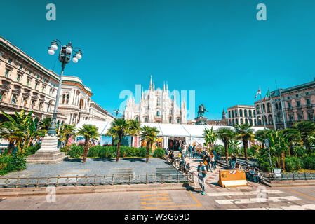 Milan, Italy - 1st of May, 2019: View of Duomo di Milano Cathedral with people around it. Authentic toned image. Stock Photo