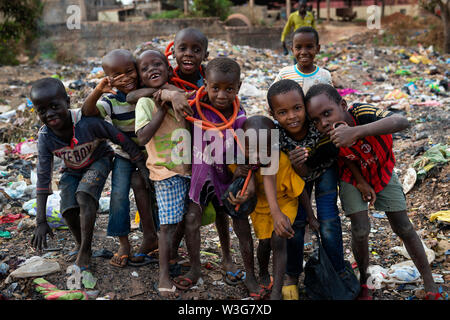 Bissau, Republic of Guinea-Bissau - February 8, 2018: Group of children at a landfill in the city of Bissau, in Guinea-Bissau, West Africa Stock Photo