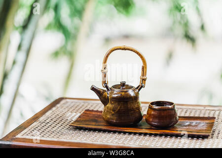 Vintage brown tea set on wooden table. Traditional tea ceremony. Eco concept. Stock Photo