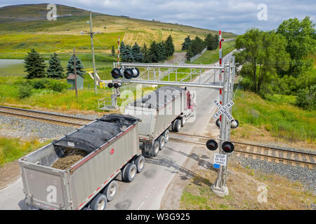 Northville Township, Michigan - A truck crosses a railroad track on its way to the Advanced Disposal landfill. Stock Photo