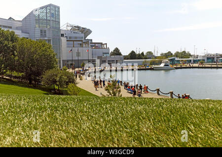 The Cleveland waterfront in the Northcoast Harbor has a popular promenade connecting major attractions, greenspace, and the lakefront. Stock Photo
