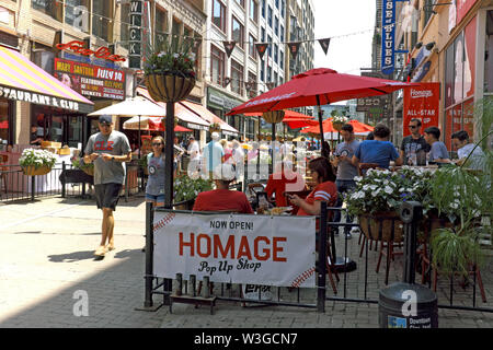 Busy East 4th street with its cafes, bars, and outdoor dining during the summer in downtown Cleveland, Ohio, USA. Stock Photo