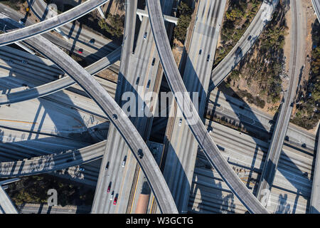 Afternoon aerial above the Harbor 110 and Century 105 freeways interchange ramps in Los Angeles, California. Stock Photo