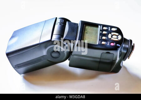External DSLR camera flash on white background in close up view Stock Photo