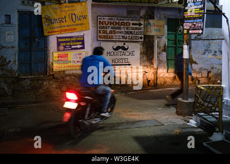 UDAIPUR, INDIA - CIRCA NOVEMBER 2018: Street of Udaipur at night. The city is the historic capital of the kingdom of Mewar. Surrounded by Aravali Rang Stock Photo
