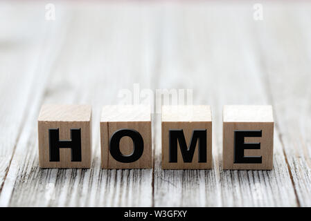 Alphabet letter word home on wood background Stock Photo